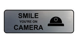 Standard Smile You're On Camera Wall or Door Sign