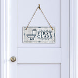 This is a First-Class Toilet 5x10 Hanging Wall or Door Sign | Warm Welcoming Signage For Homes