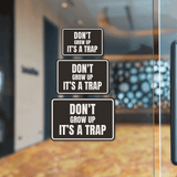 Classic Framed Plus Don't Grow Up IT's A Trap Wall or Door Sign | Funny Funny Home & Office Signage