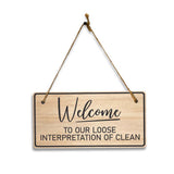 Welcome To Our Loose Interpretation Of Clean 5x10 Hanging Plus Wall or Door Sign | Religious Home Decor