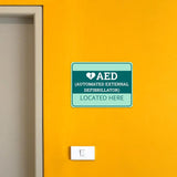 Classic Framed Plus AED (Automated External Defibrillator) Located Here Door or Wall Sign | Health and Safety Workplace Warning
