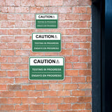 Classic Framed Plus Caution Testing In Progress Wall or Door Sign | Bilingual Spanish and English Workplace Safety Signage