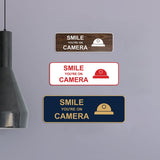 Standard Smile You're On Camera Wall or Door Sign