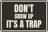 Classic Framed Plus Don't Grow Up IT's A Trap Wall or Door Sign | Funny Funny Home & Office Signage