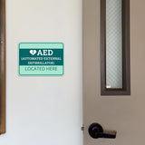 Classic Framed Plus AED (Automated External Defibrillator) Located Here Door or Wall Sign | Health and Safety Workplace Warning