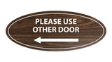 Signs ByLITA Oval Please Use Other Door Left Arrow Sign
