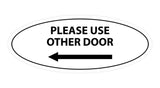 Signs ByLITA Oval Please Use Other Door Left Arrow Sign