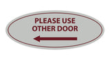 Signs ByLITA Oval Please Use Other Door Left Arrow Sign