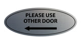 Signs ByLITA Oval Please Use Other Door Left Arrow Sign