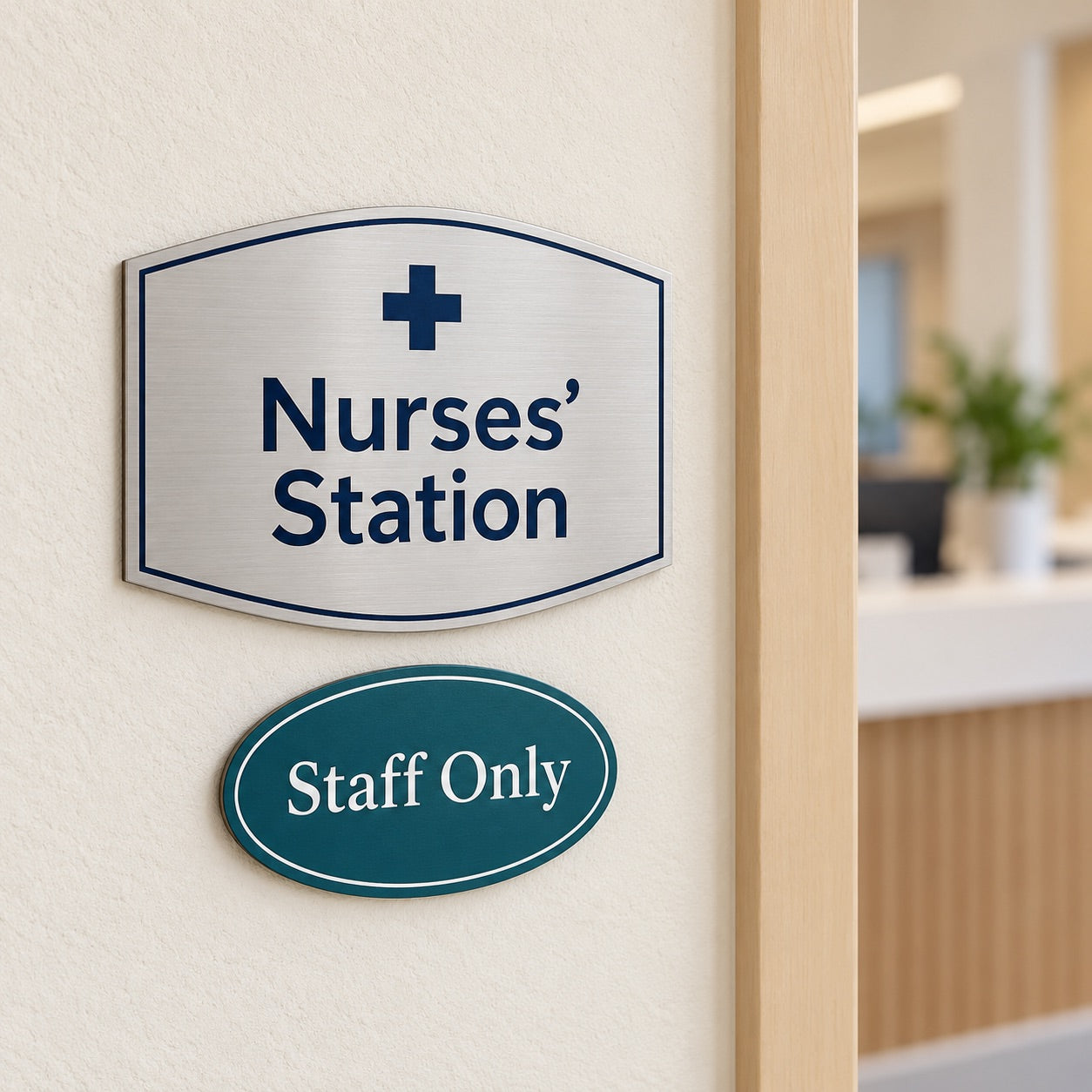 Nurses' station sign above a staff only sign outside a clinic hallway