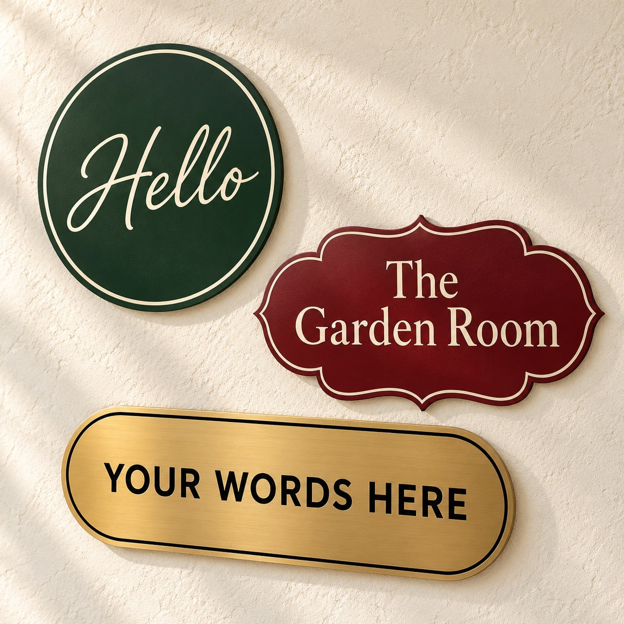 Green Hello sign, burgundy Garden Room plaque, and gold custom sign on a textured wall
